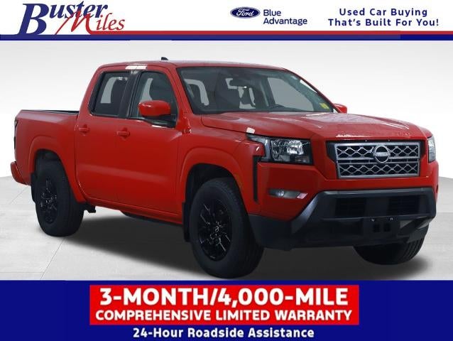 2023 Nissan Frontier SV in Red Alert — front three-quarter view